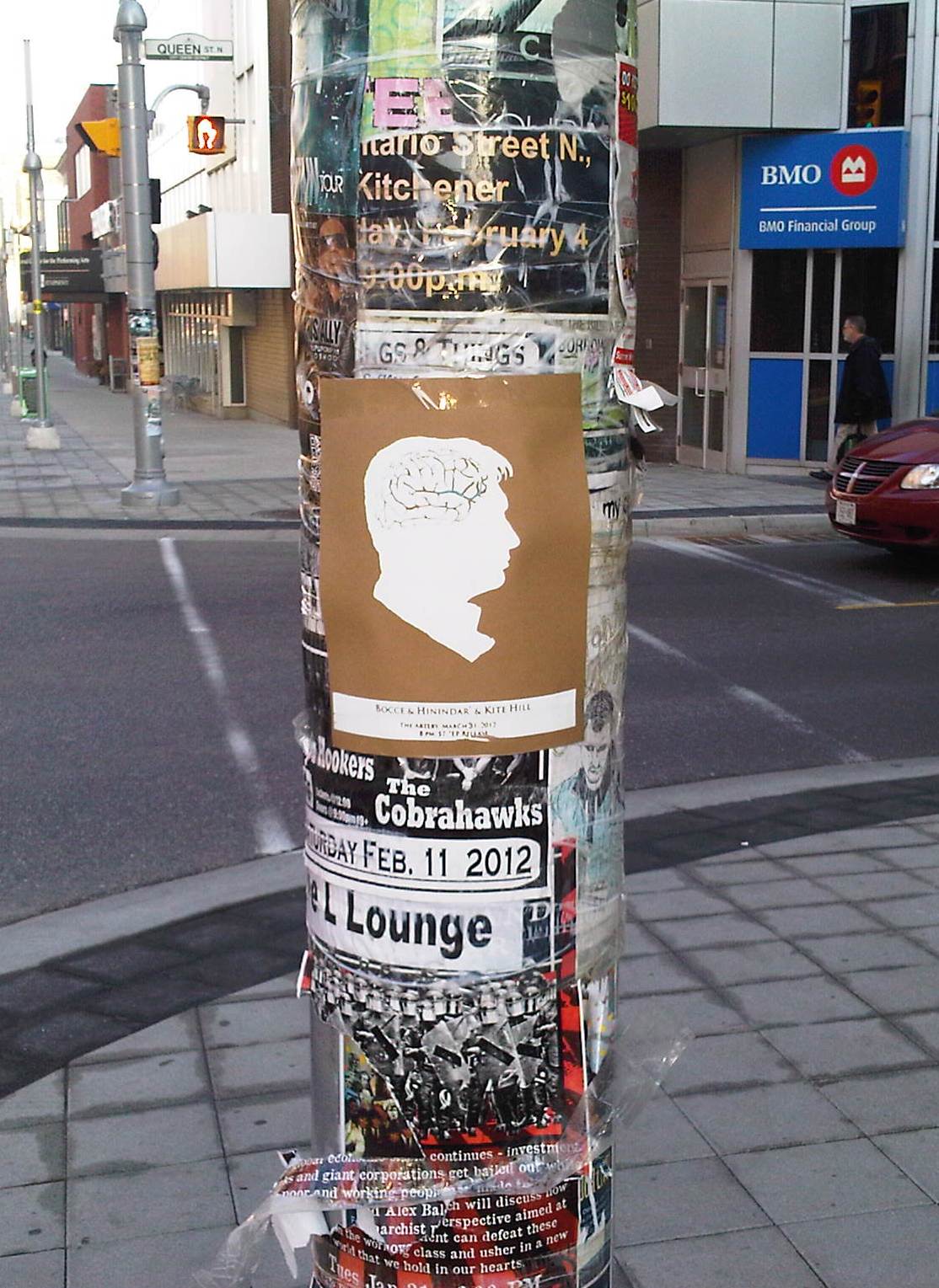 artery poster art show poster on street post filled with posters